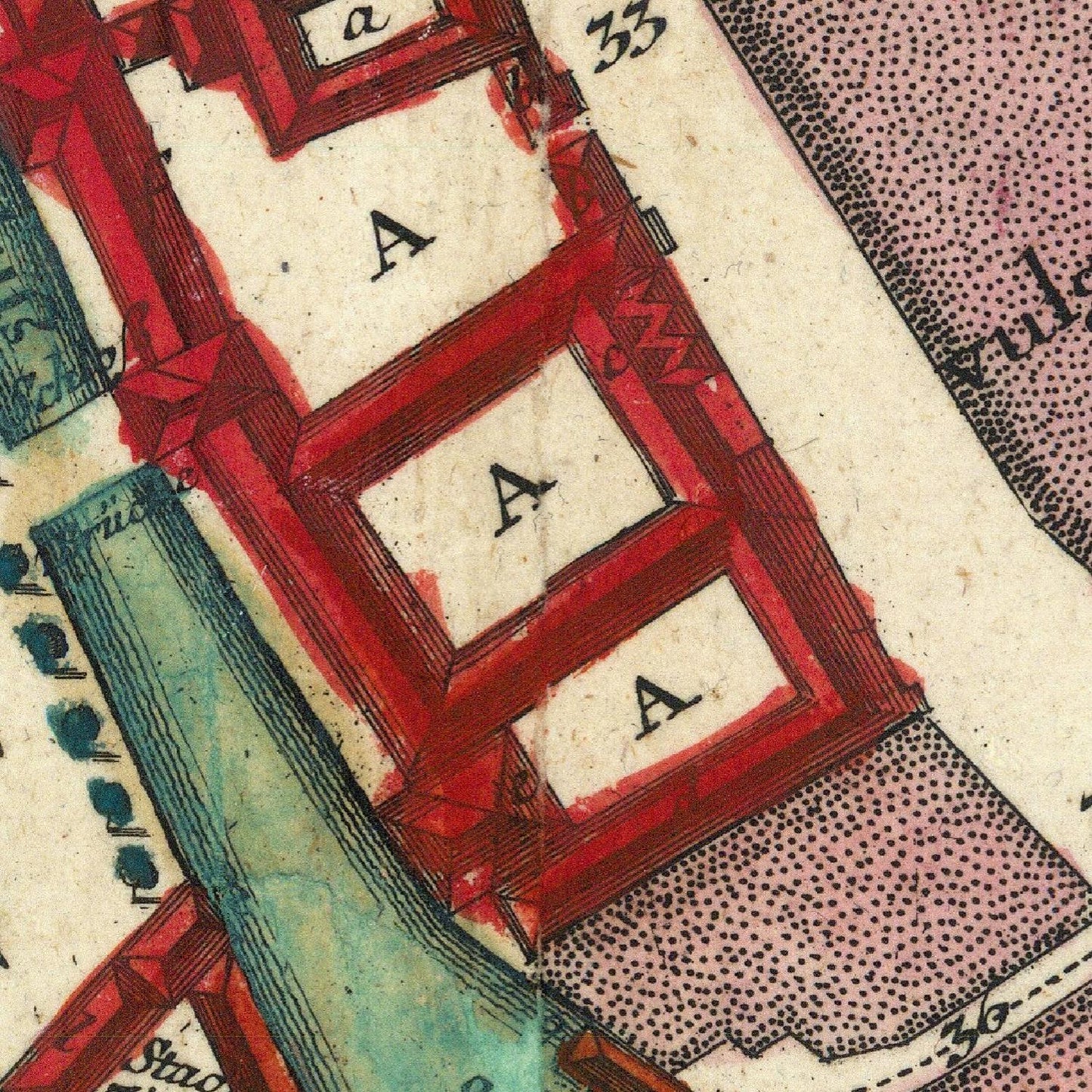 Close-up of a vintage map with red and green borders and 'A' labels.