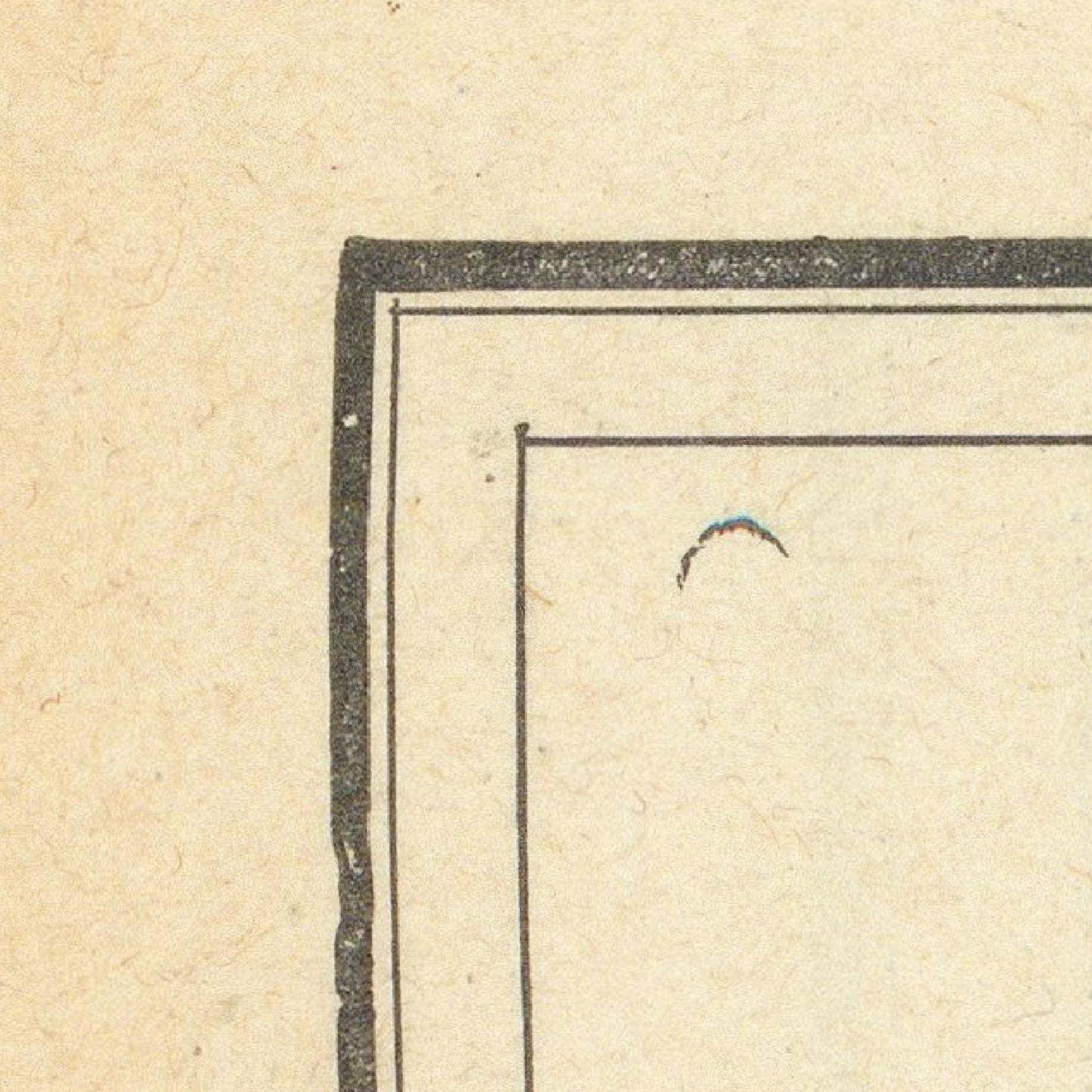 Corner of a document with a black border on beige paper