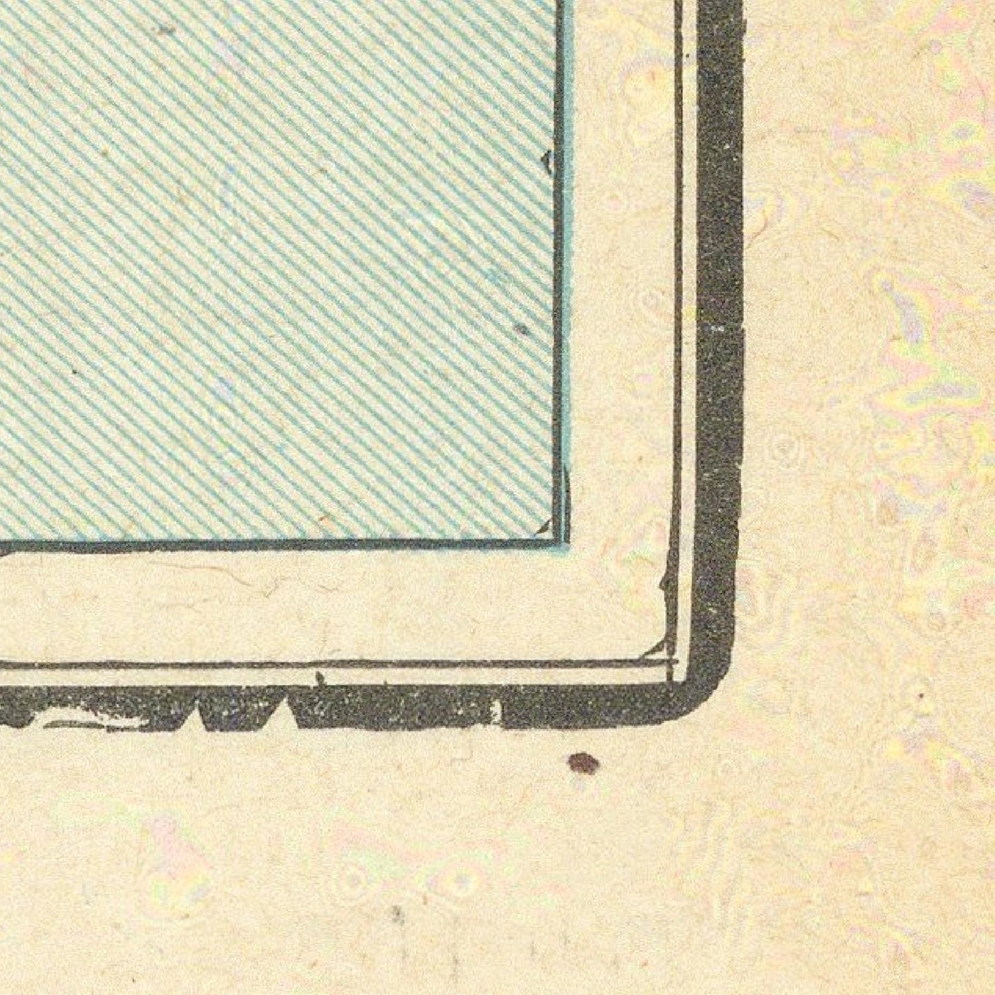 Corner of a textured paper with a green striped area