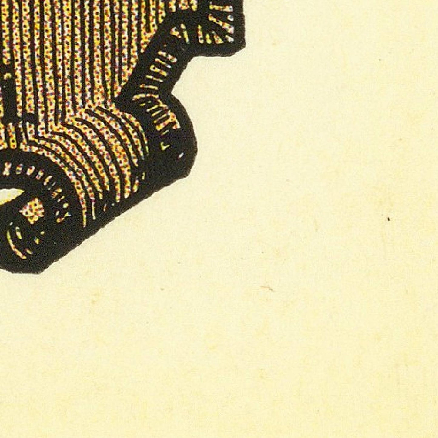 Close-up of a black and gold pattern on a beige background