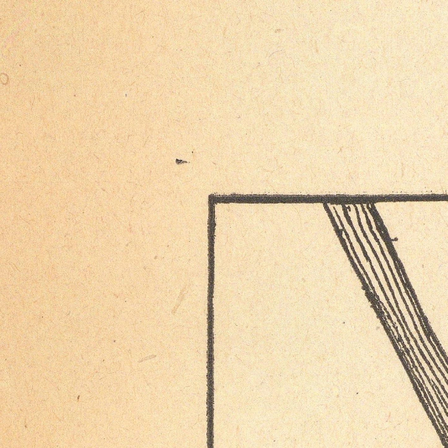 Corner of a document with printed text on beige paper