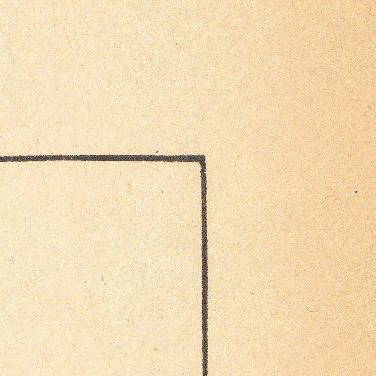 Corner of a piece of paper with a black line on a beige background