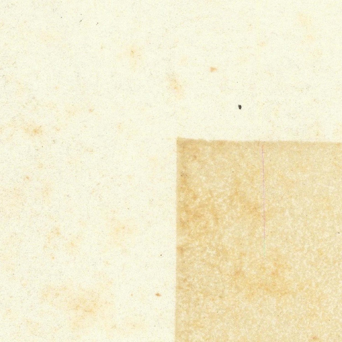 Close-up of textured beige paper with a square cutout