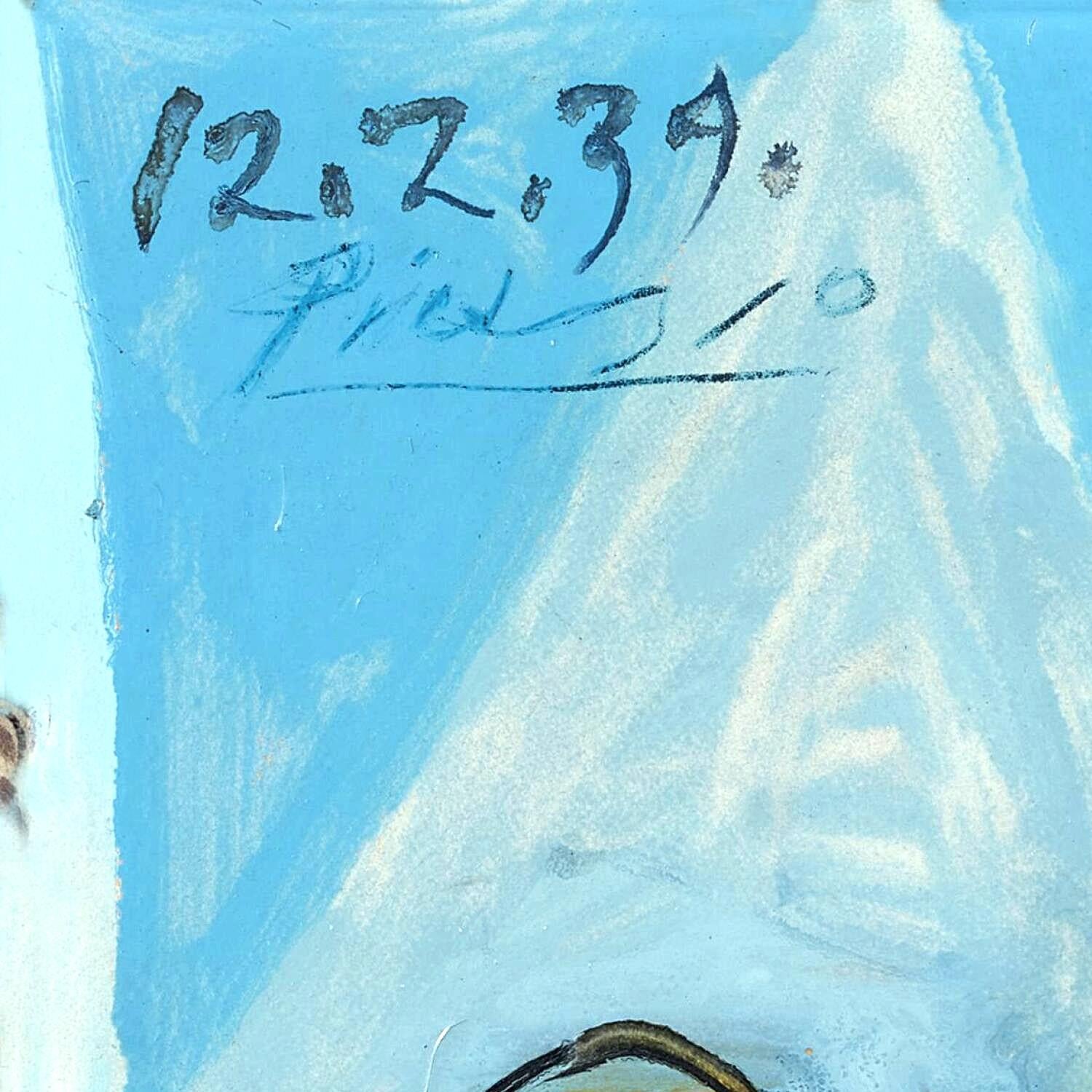 Ice sculpture with '12.2.39' and a signature on a blue background