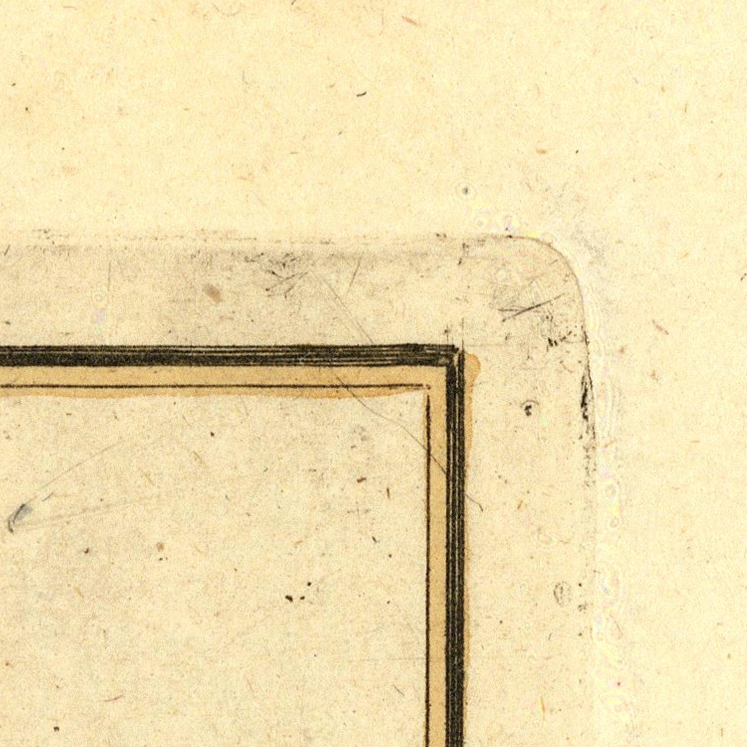Corner of a vintage document with a gold border on beige paper