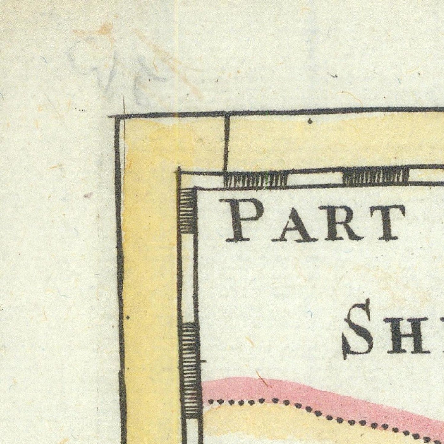 Close-up of an old map with text and a yellow section