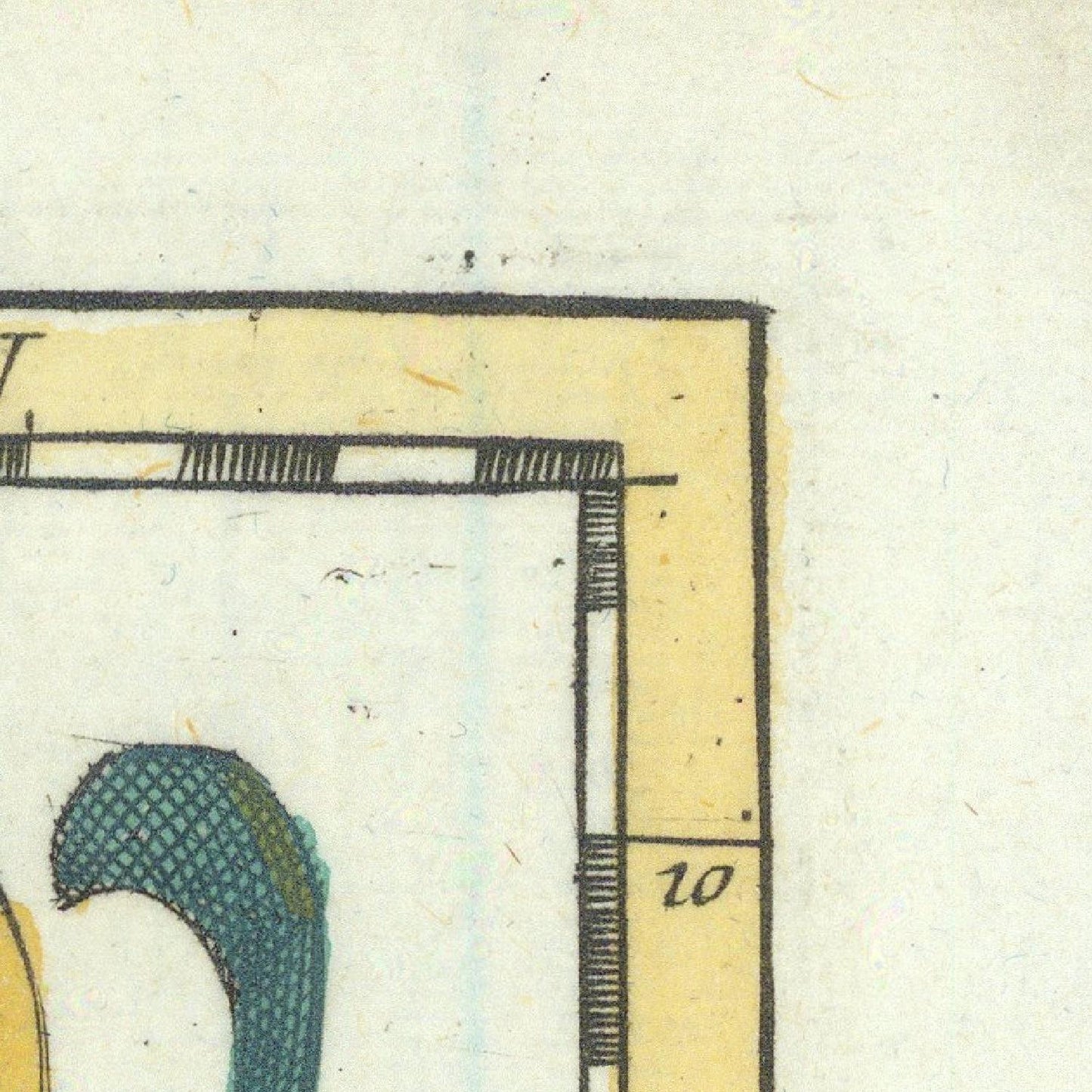 Close-up of a vintage map with text and symbols on a light background