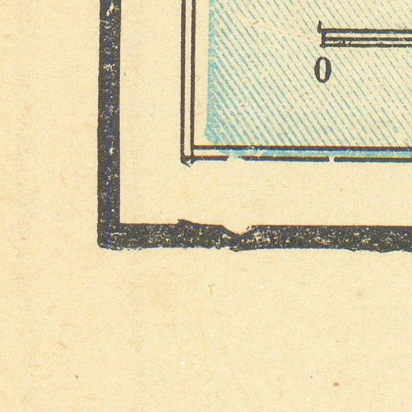 Close-up of a corner of a printed document with text and numbers on a beige background