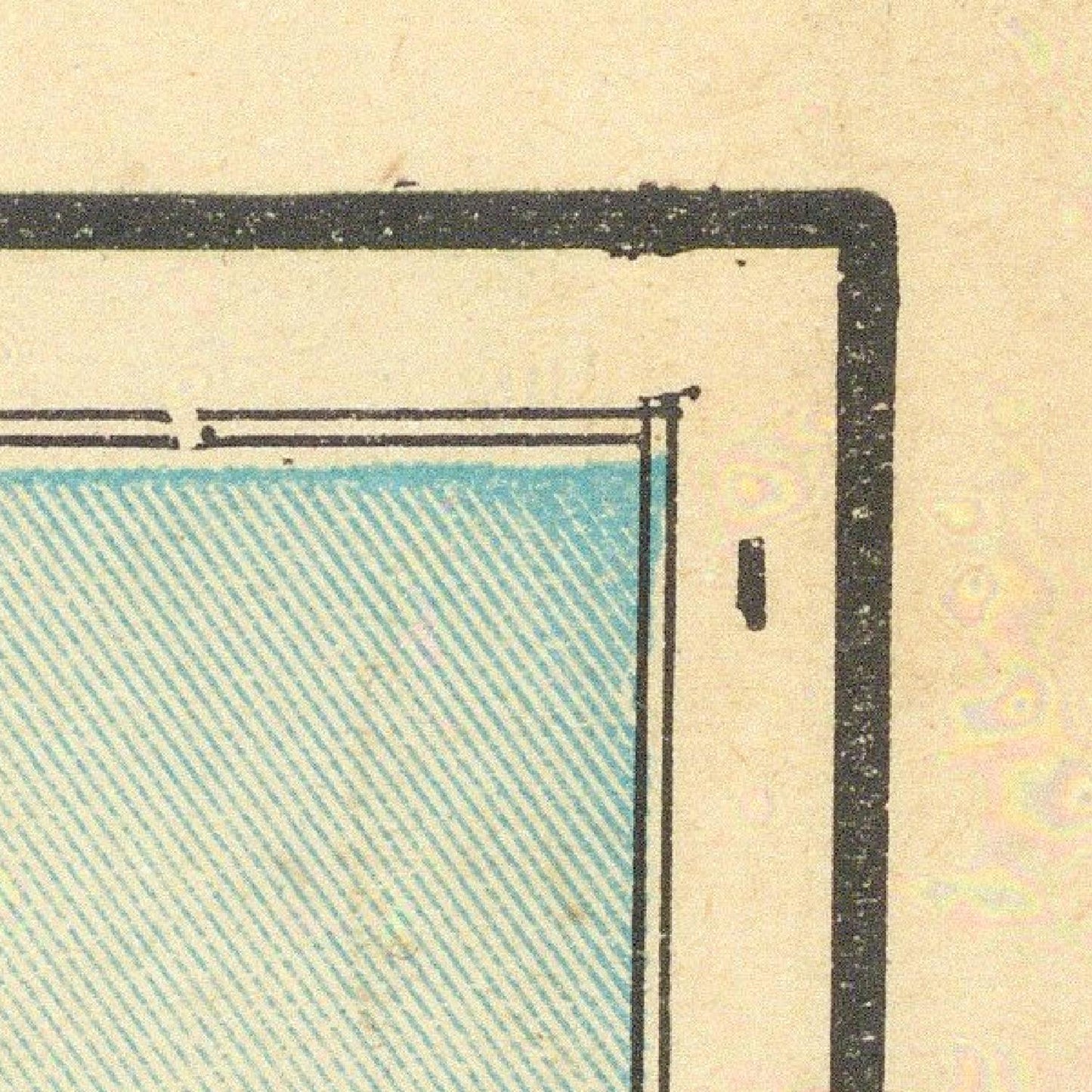 Corner of a vintage document with blue diagonal pattern and black border