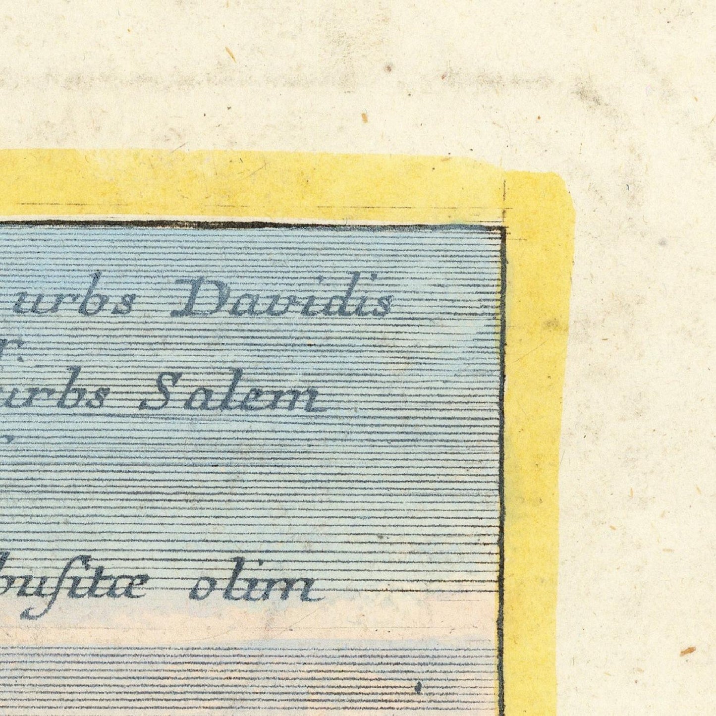 Close-up of a vintage map corner with text and a yellow border.