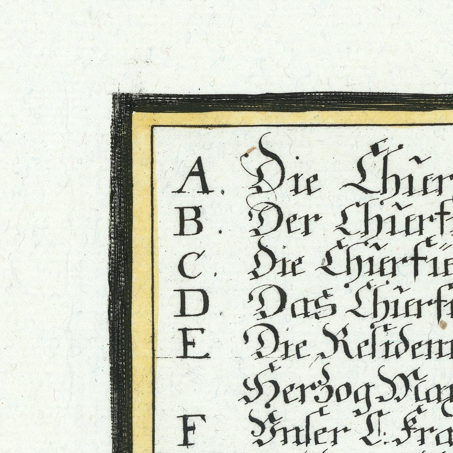 Corner of a document with text in a decorative font on a white background