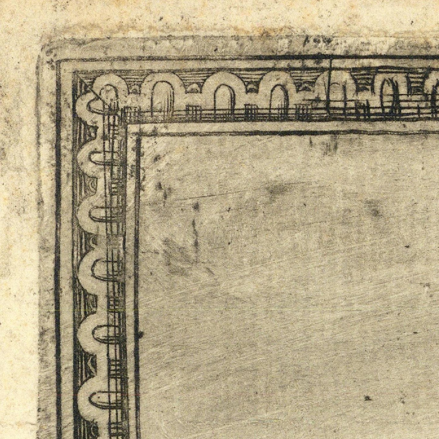 Corner of a textured paper with decorative border
