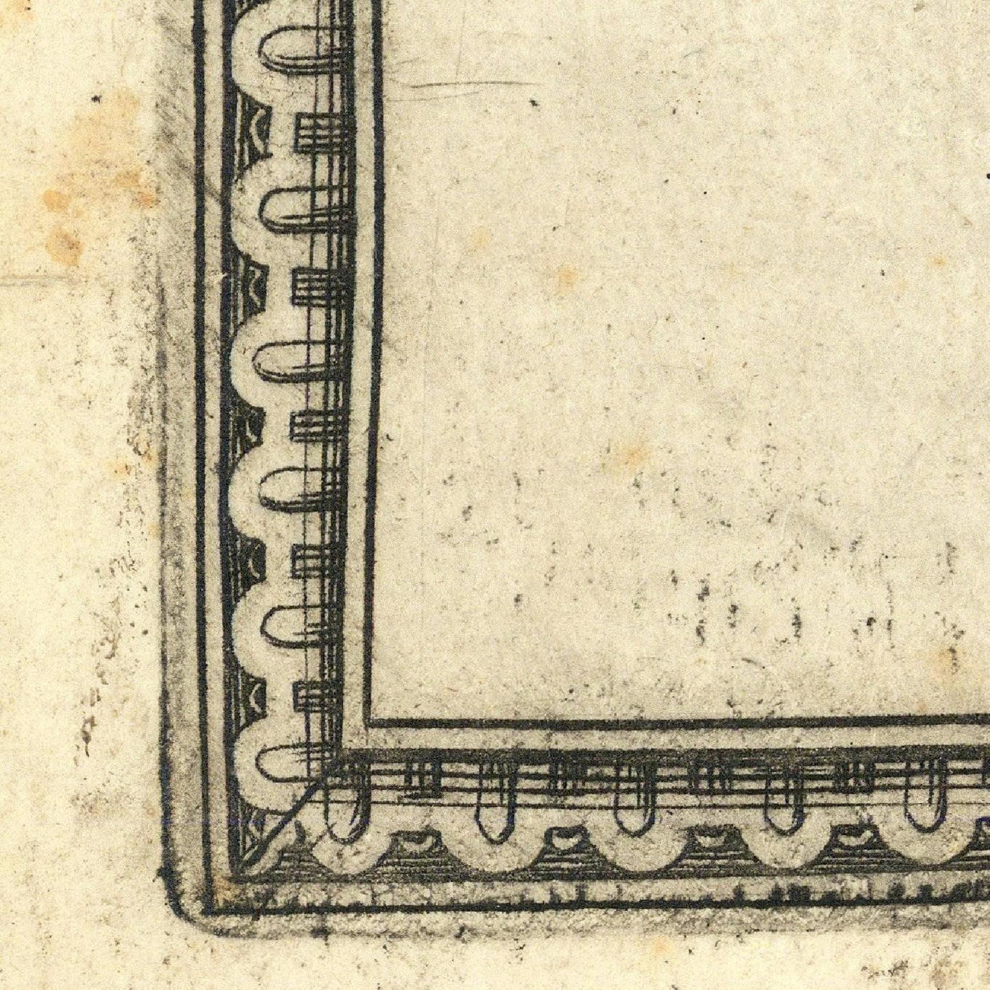 Corner of a printed document with decorative border on beige paper
