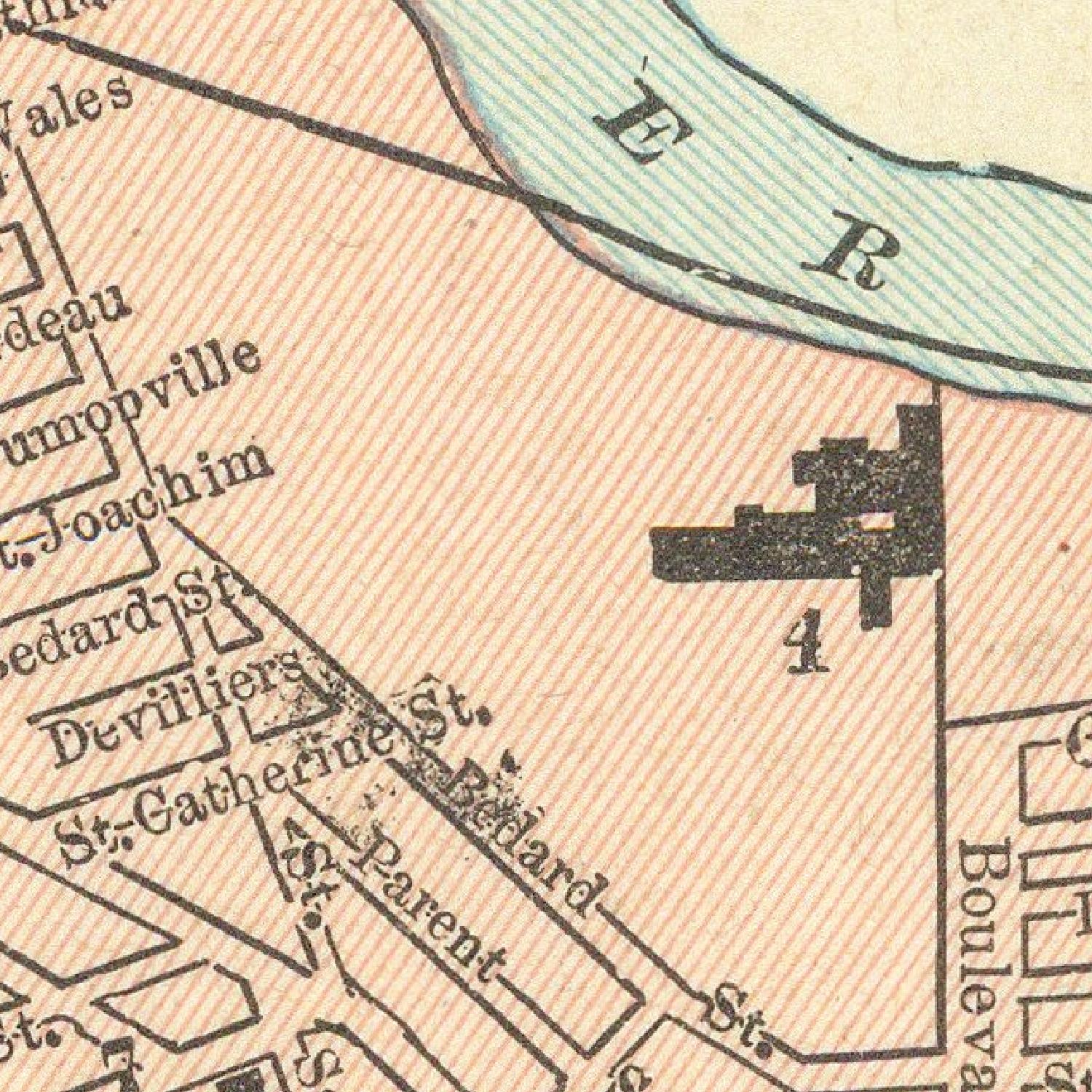 Vintage map section with street names and a river labeled 'E R'.