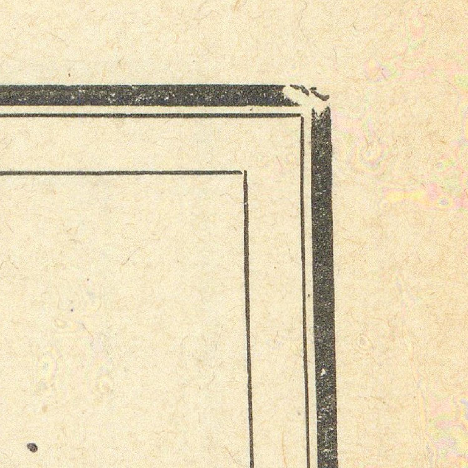 Corner of a book with black border on beige paper