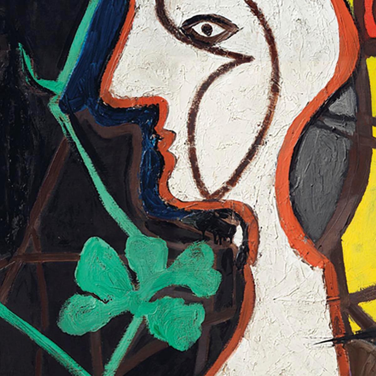 Abstract artwork with a face and green leaves on a textured surface