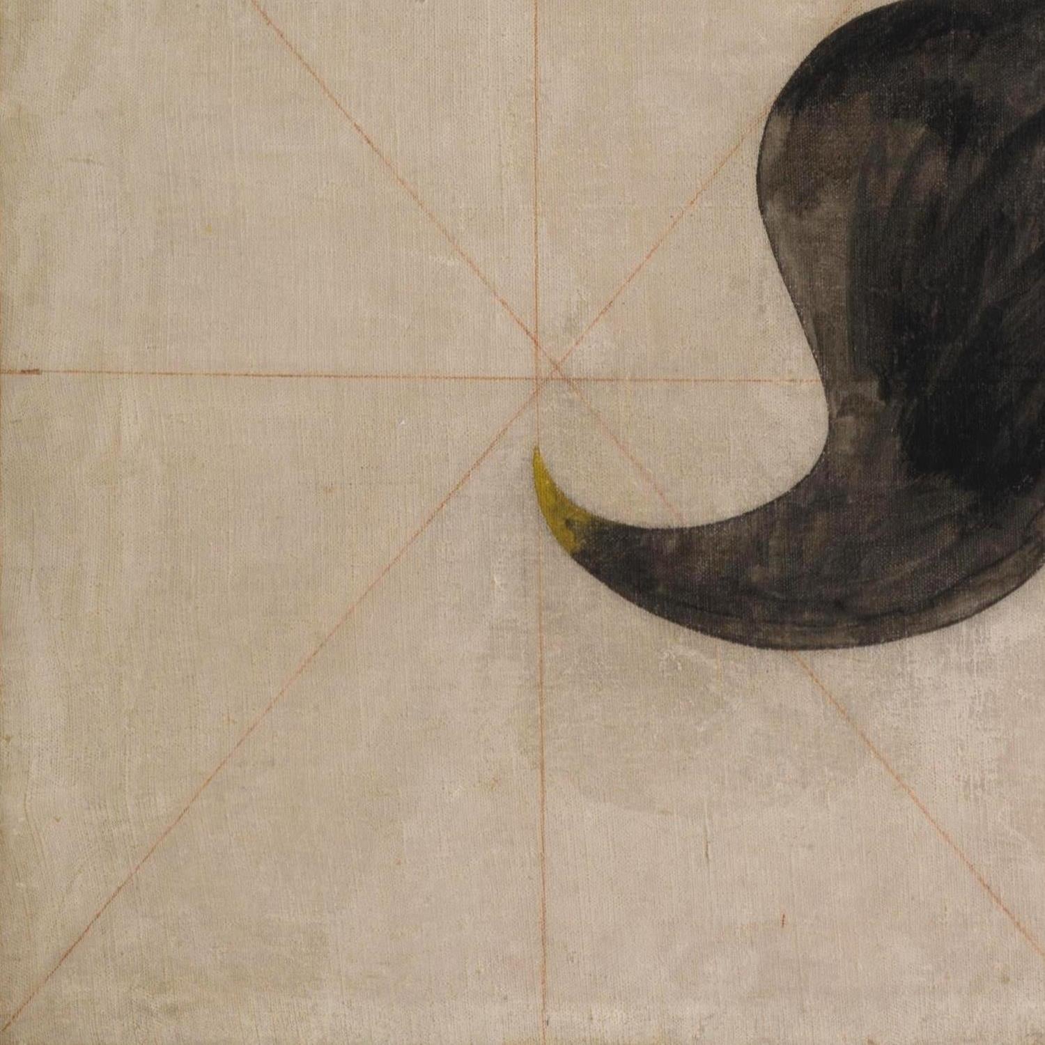 Black cat tail on a textured beige background