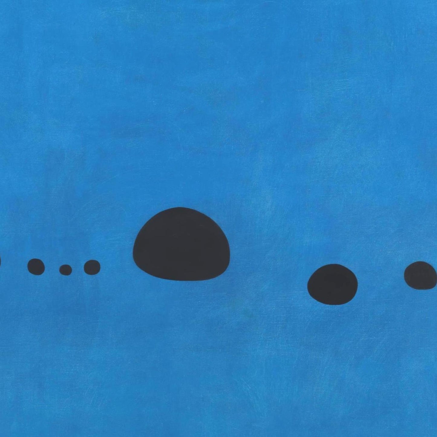 Black dots on a blue textured background