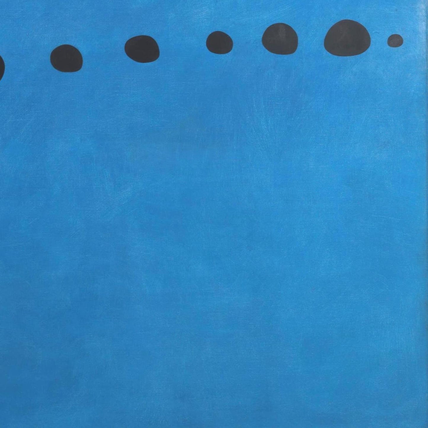 Blue background with black dots arranged in a pattern