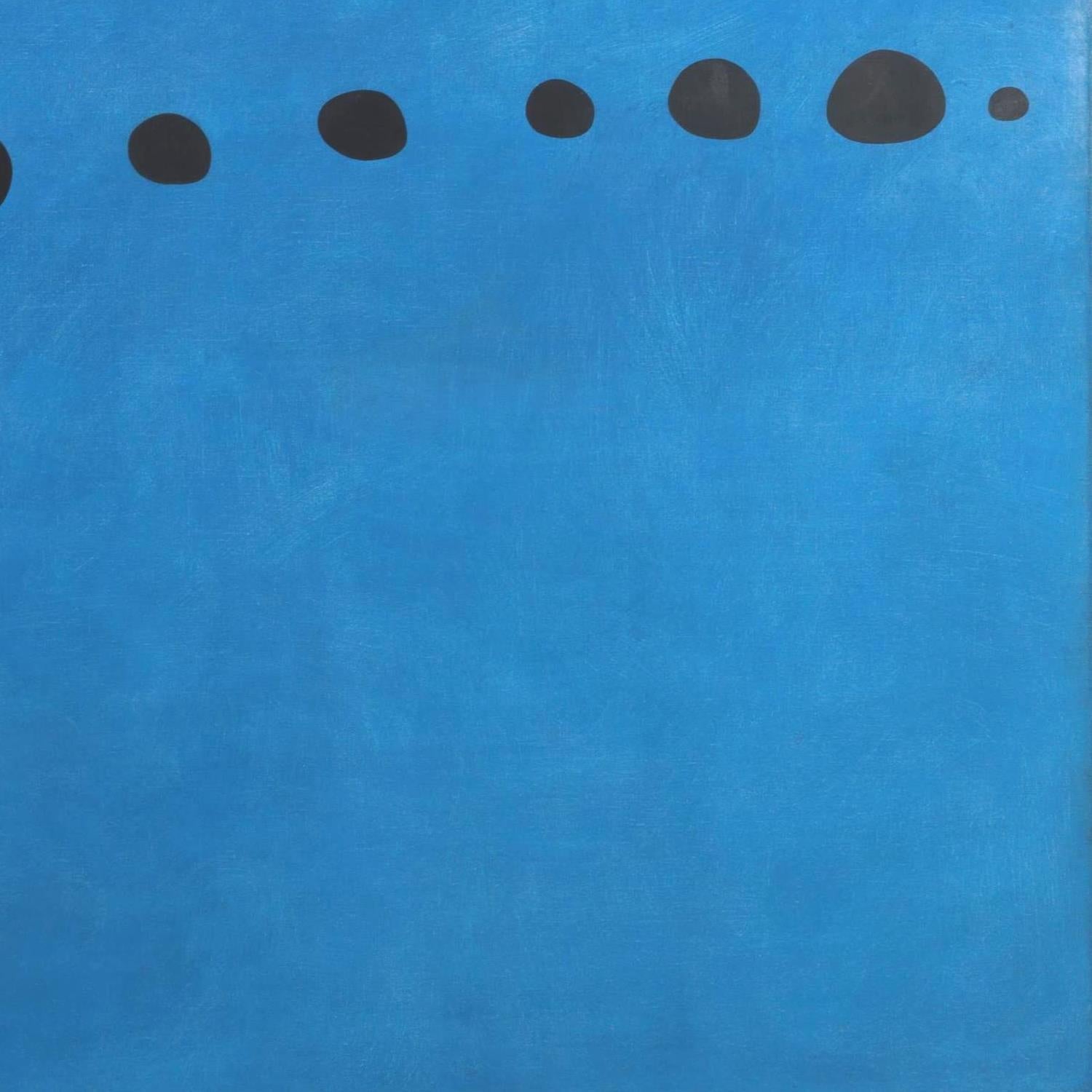 Blue background with black dots arranged in a pattern