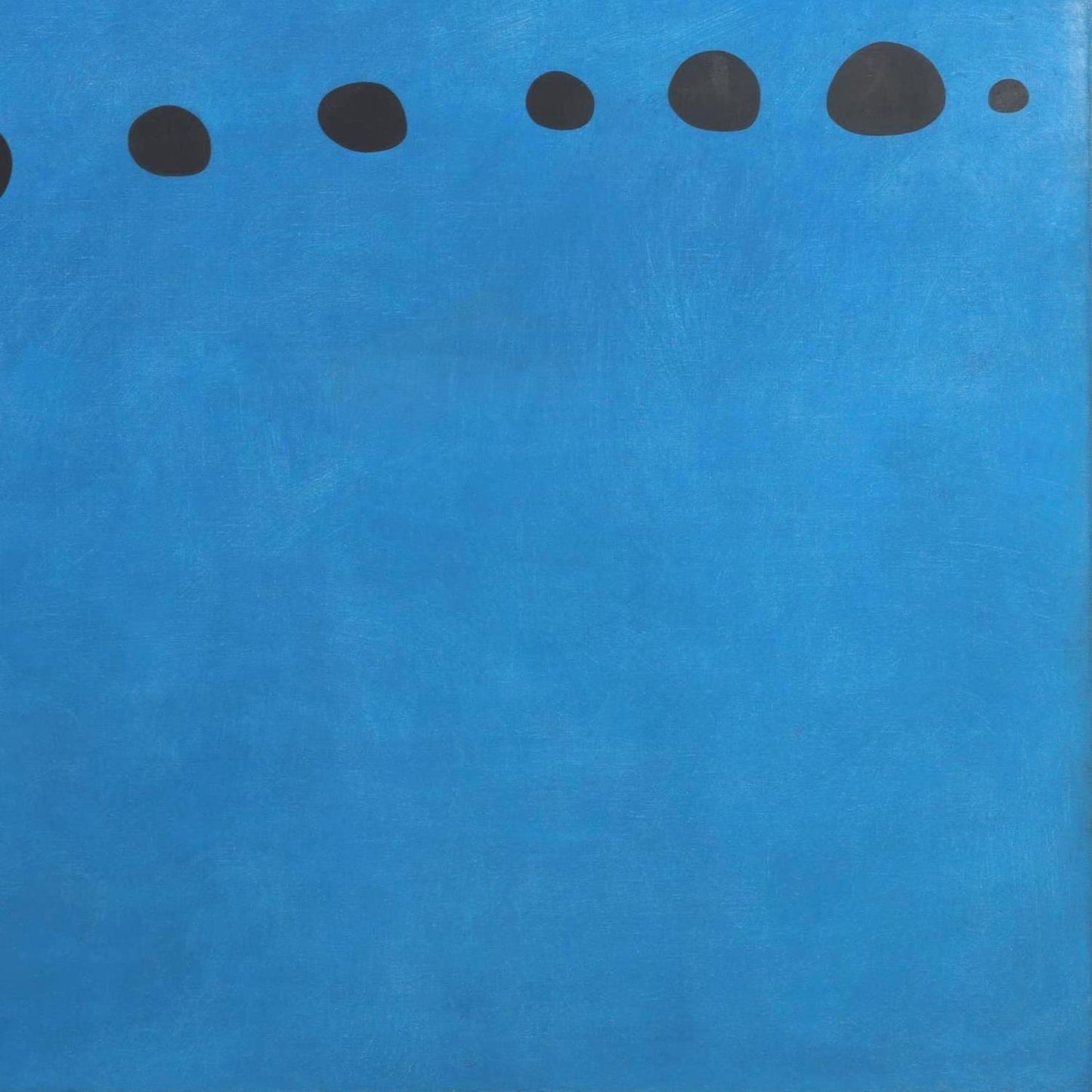 Blue background with black dots arranged in a line