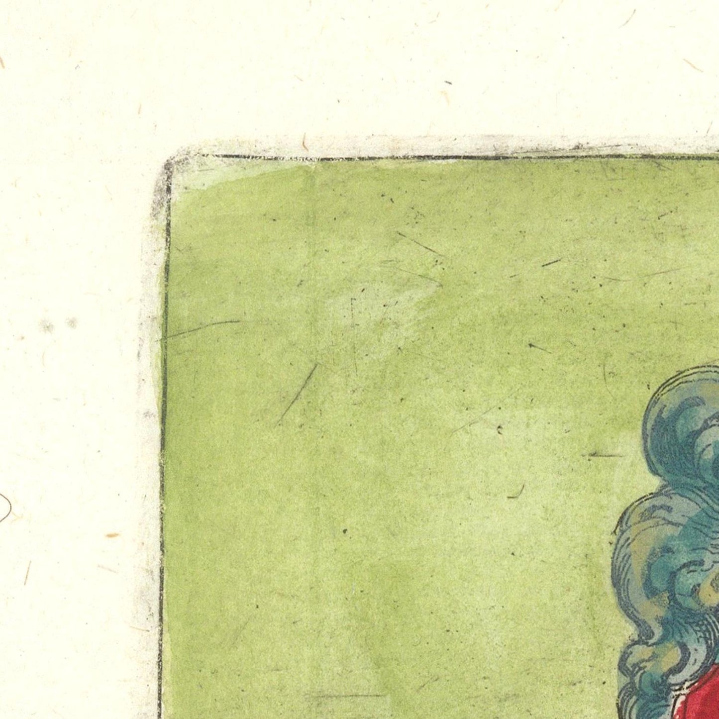 Corner of a vintage card with a green background and decorative elements.