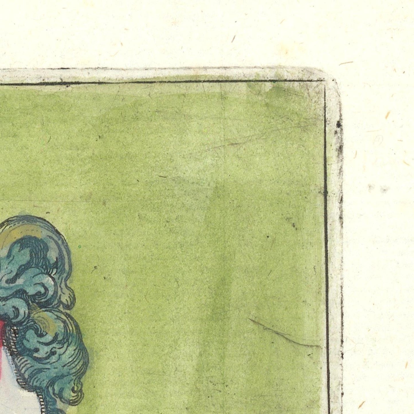 Close-up of a textured green surface with a decorative element on the left corner.