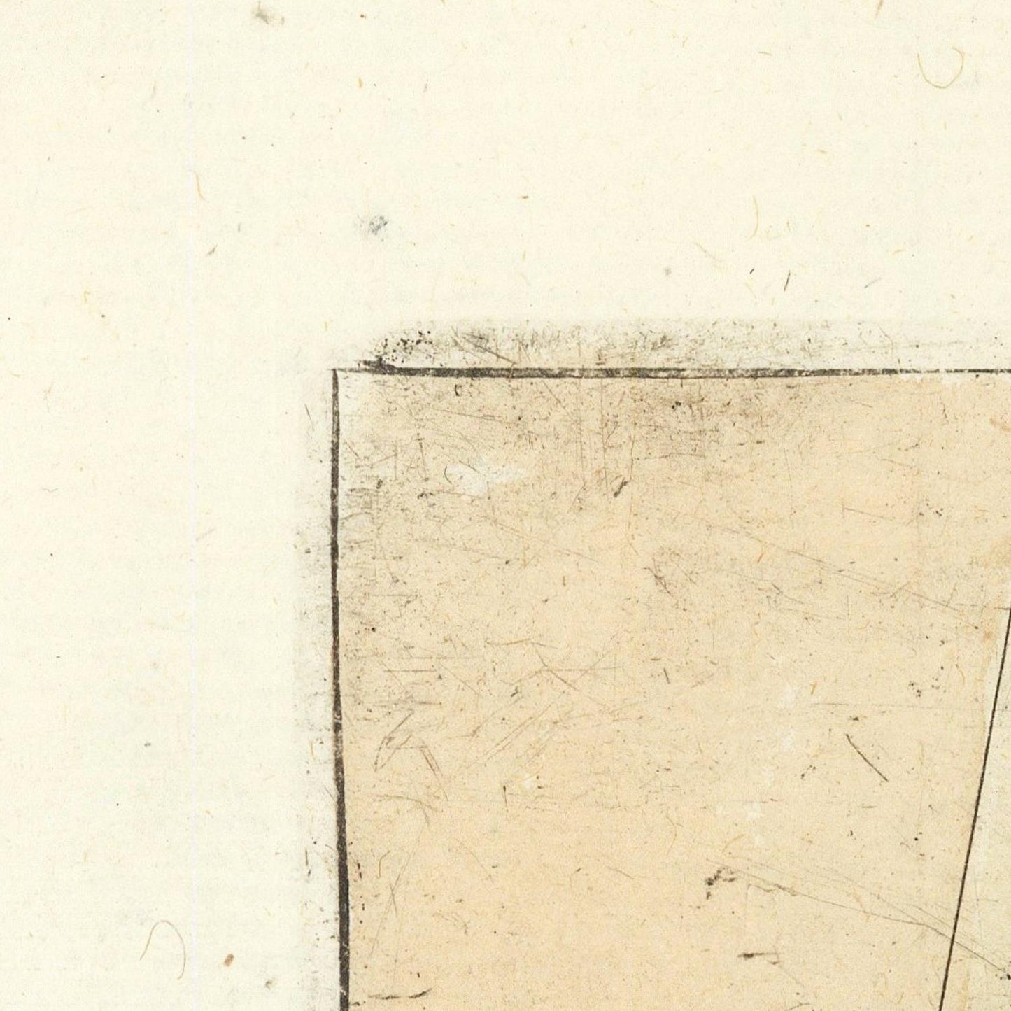 Close-up of a textured beige surface with a square cutout