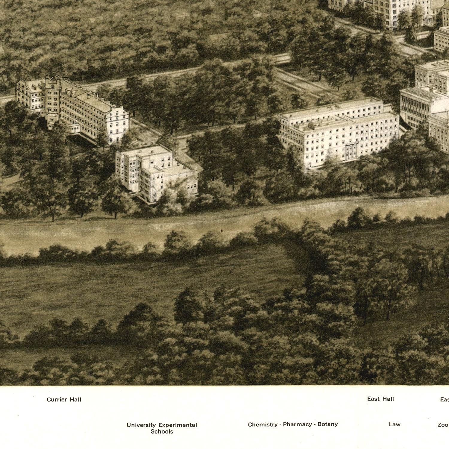 Aerial view of a campus layout with buildings and greenery, likely from an old photograph.