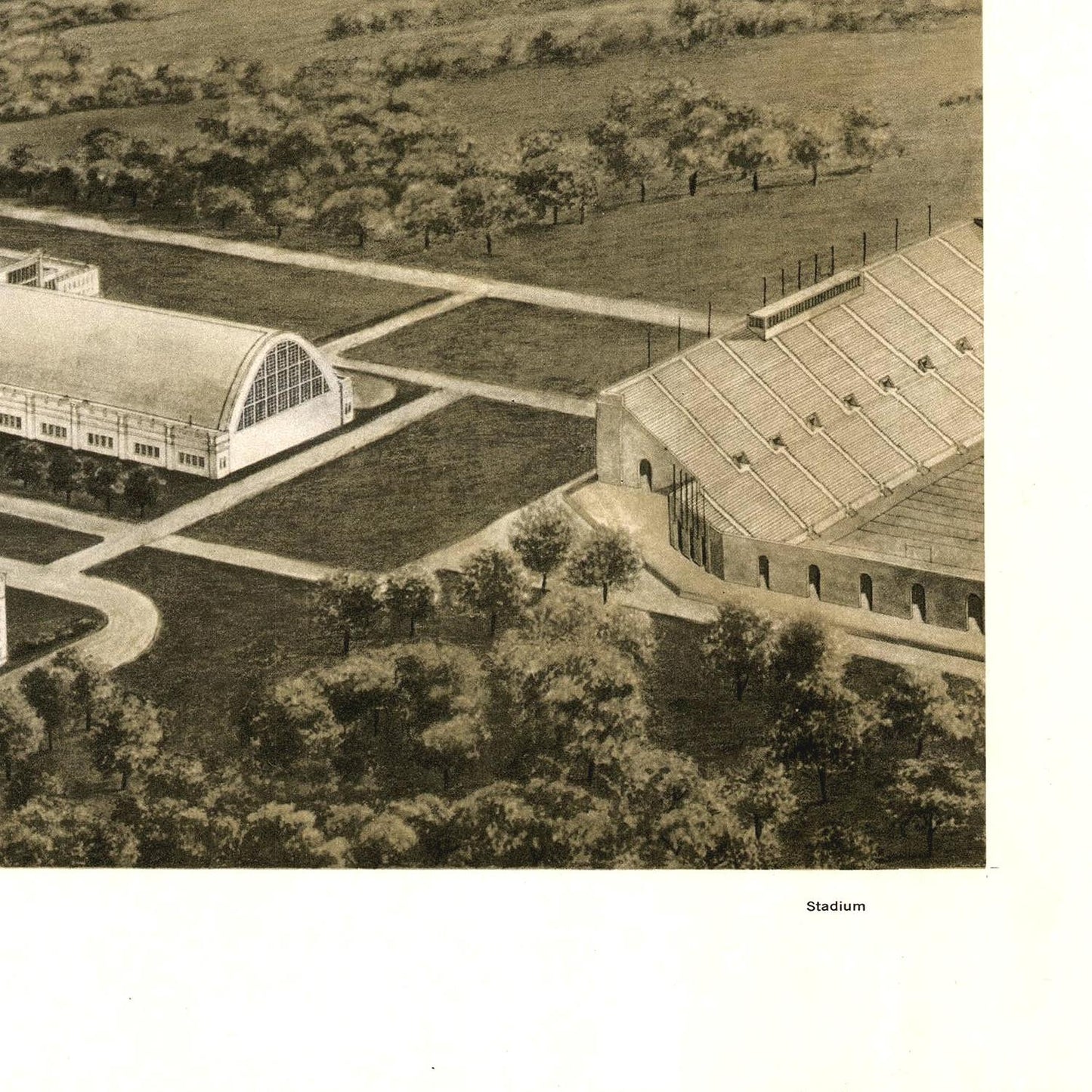 Aerial view of a stadium and surrounding area with trees and pathways.