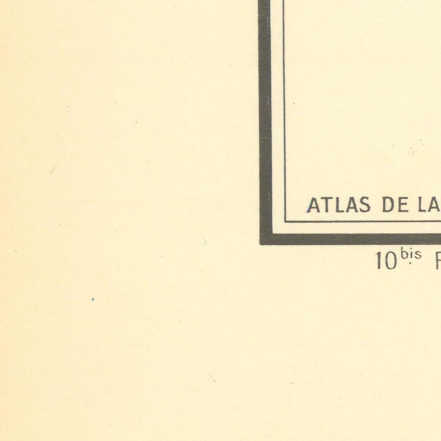 Partial view of a document with 'ATLAS DE LA' text on a beige background