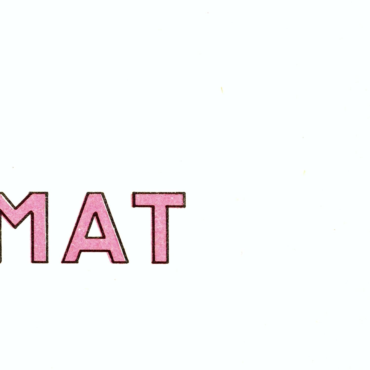 Pink text 'MAT' on a white background