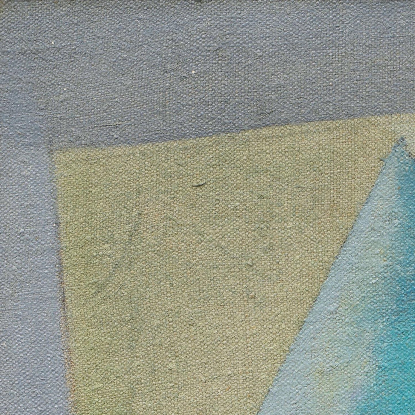 Close-up of a textured fabric with a gradient from gray to green to blue.