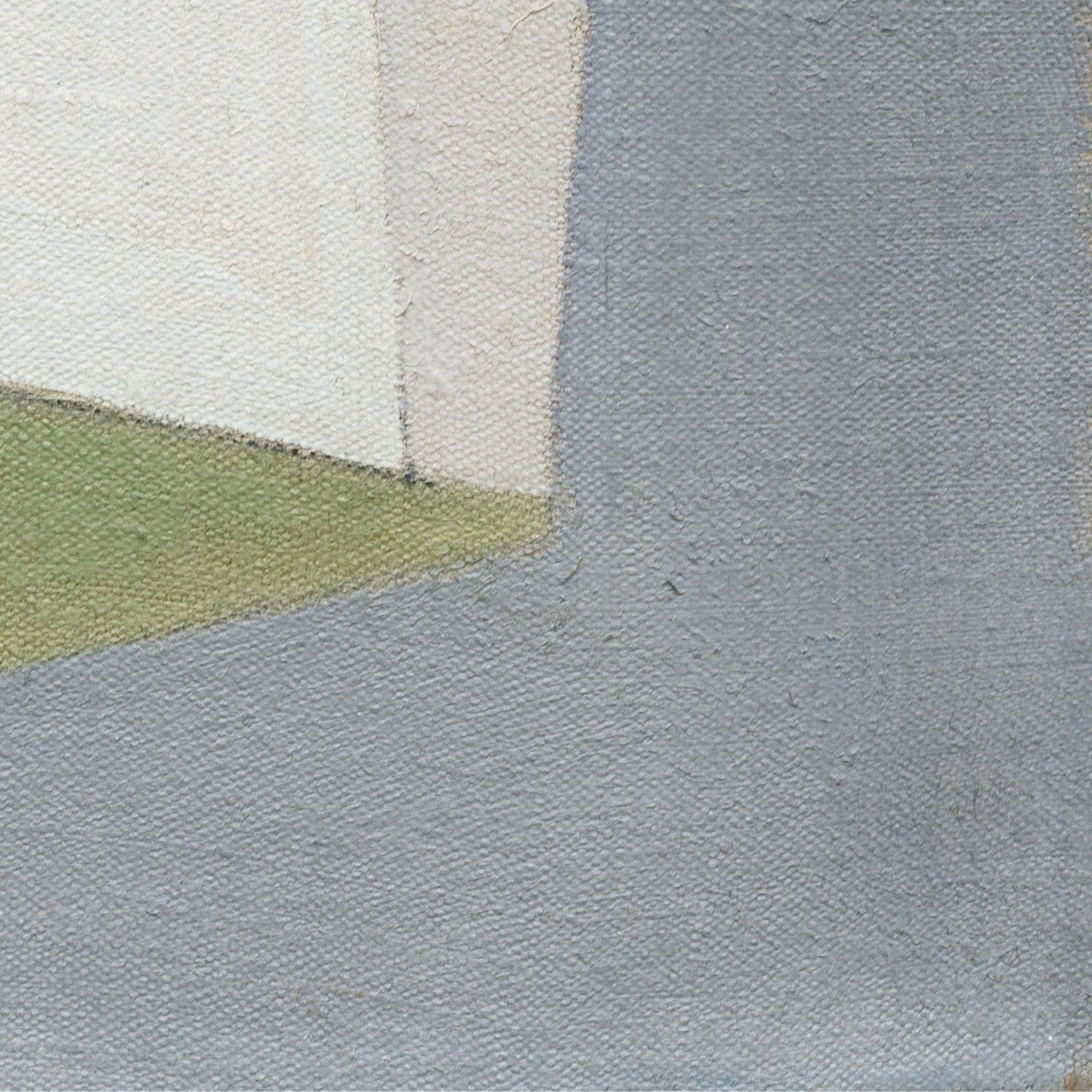 Close-up of a textured fabric with a geometric pattern in gray, green, and white.