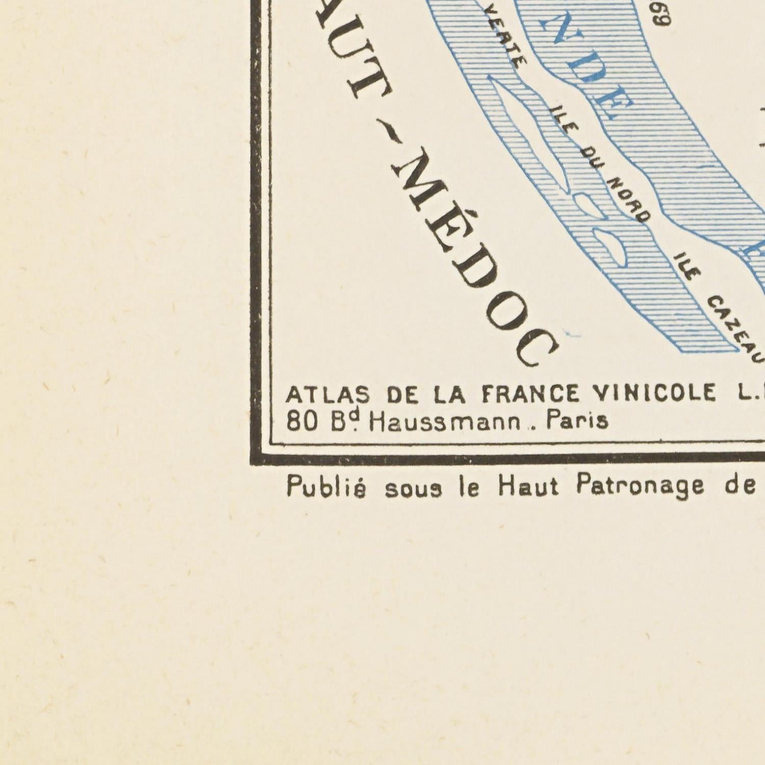 Vintage map of Haut-Medoc with text and a corner of a map in blue.