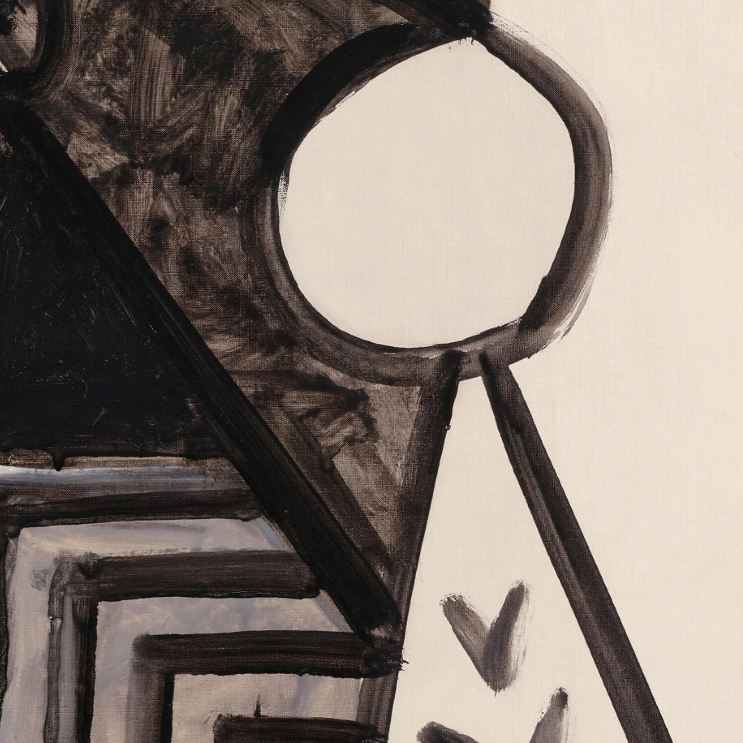 Close-up of a magnifying glass held over a textured surface