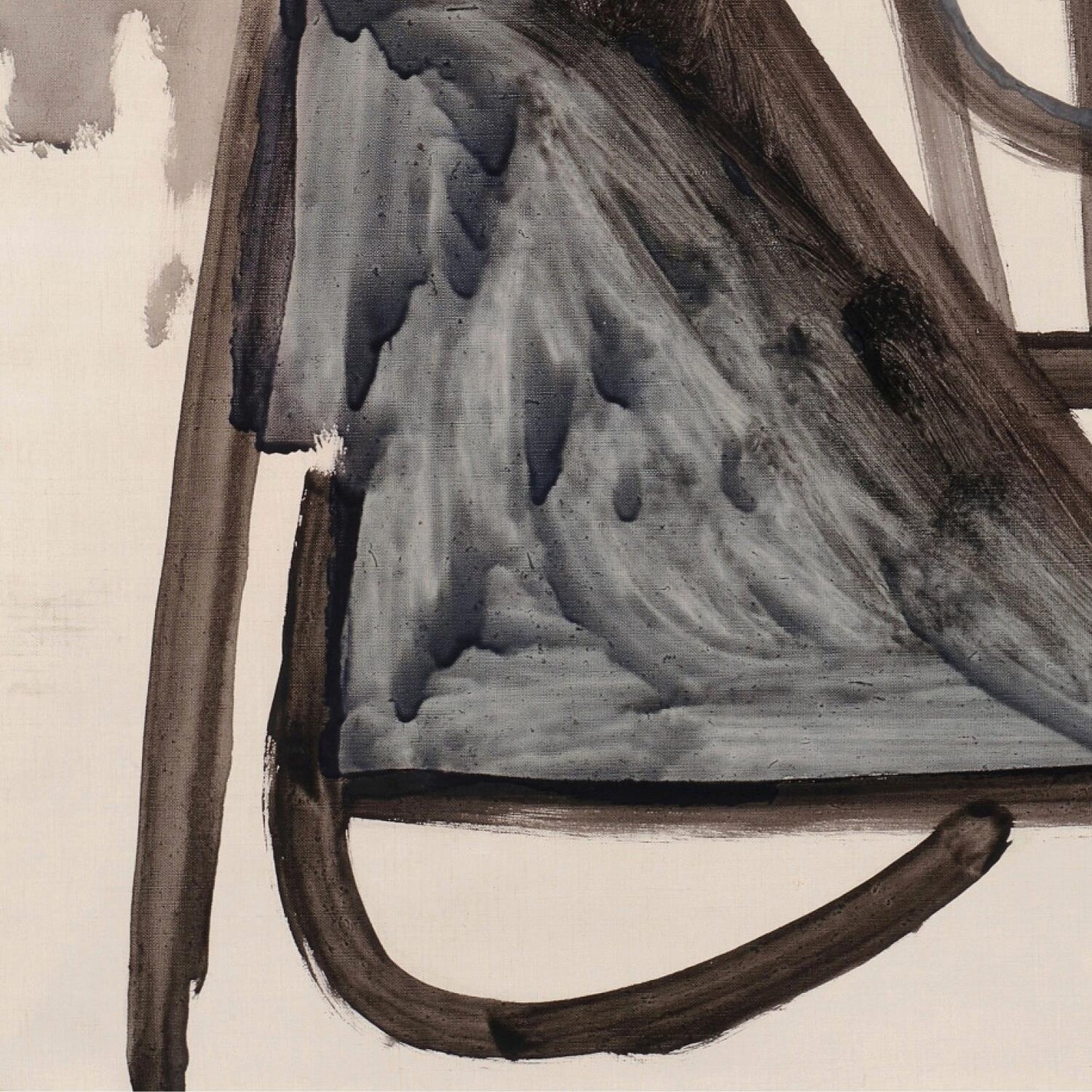 Close-up of a wooden chair with a textured surface on a light background