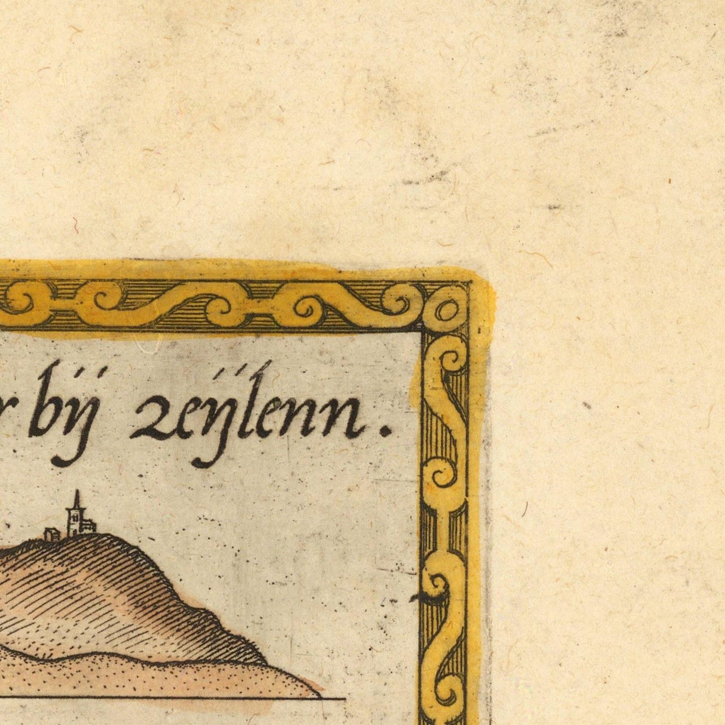 Close-up of a vintage printed page corner showing part of a landscape illustration with a hill and a small tower, black script text, and an ornate yellow border on aged beige paper.