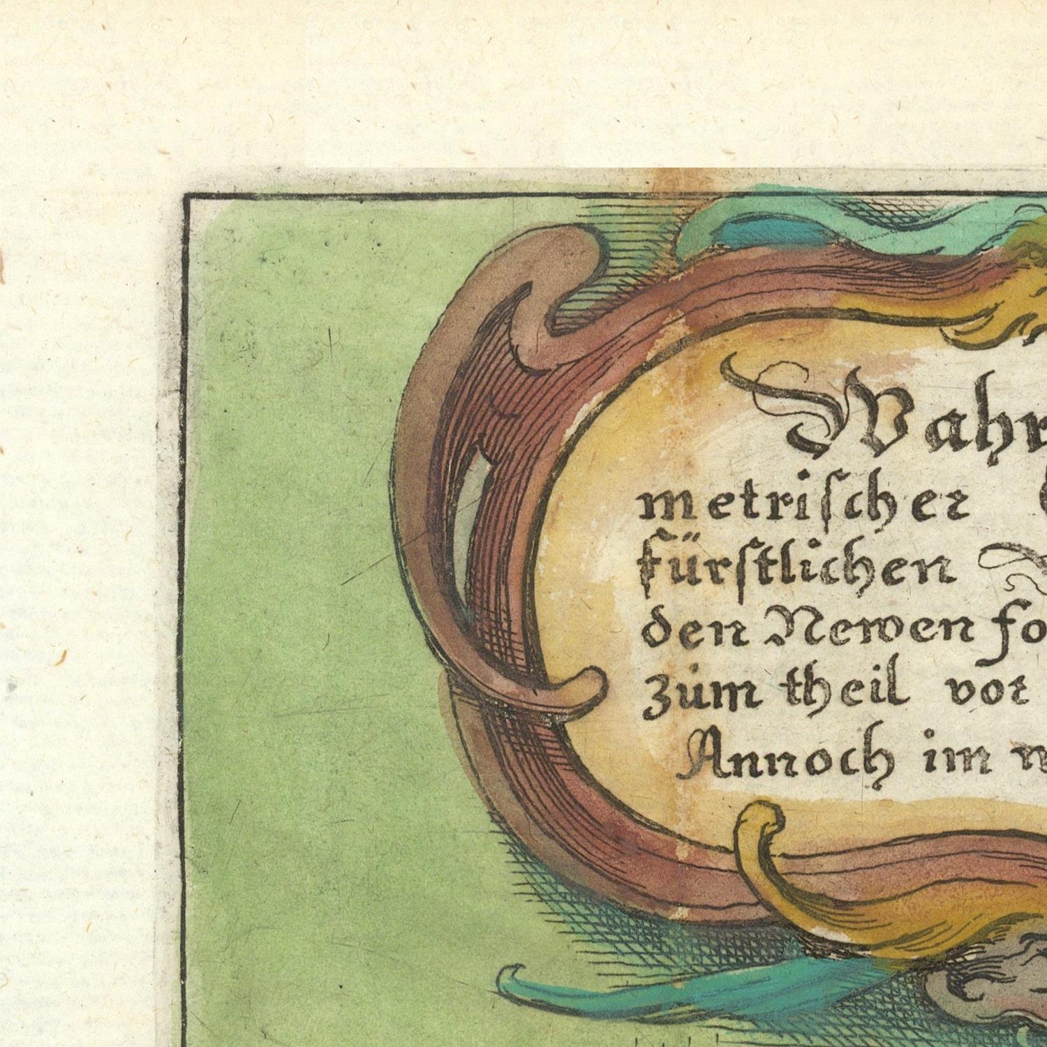 Close-up of a vintage printed page showing part of a decorative illuminated manuscript corner with German text, a green background, and ornate brown, yellow, and teal border details.