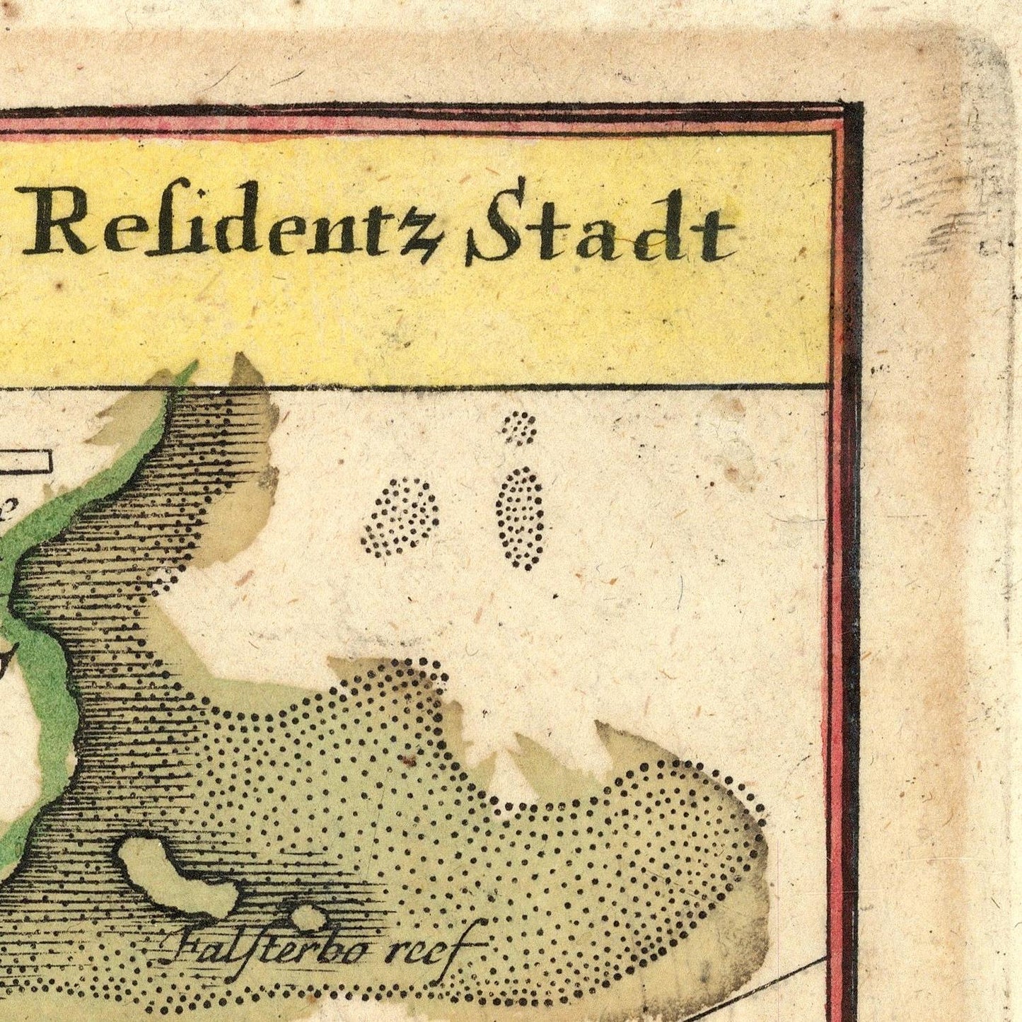 Close-up of an antique map showing a coastal region with the text 'Residentz Stadt' in a yellow header and 'Halffteeo reef' near the bottom, printed in black on aged beige paper with green and brown land details.