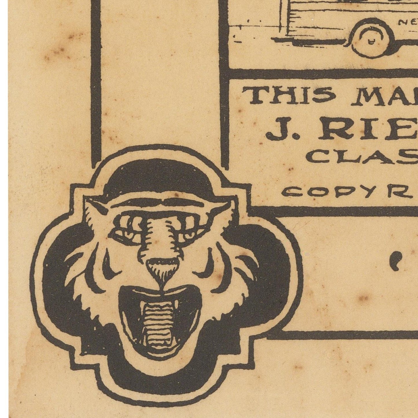 Vintage tan paper print with a black illustrated tiger head emblem and partial text reading 'THIS MAKES J. RIE.