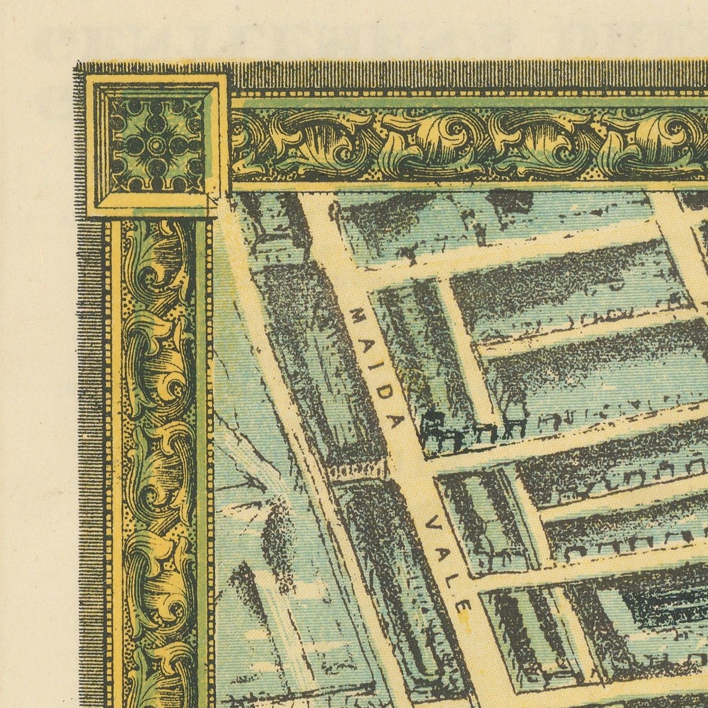 A close-up of a vintage map print showing streets and blocks with ornate decorative borders in green, gold, and cream tones. The visible text reads 'MAIDA VALLE'.